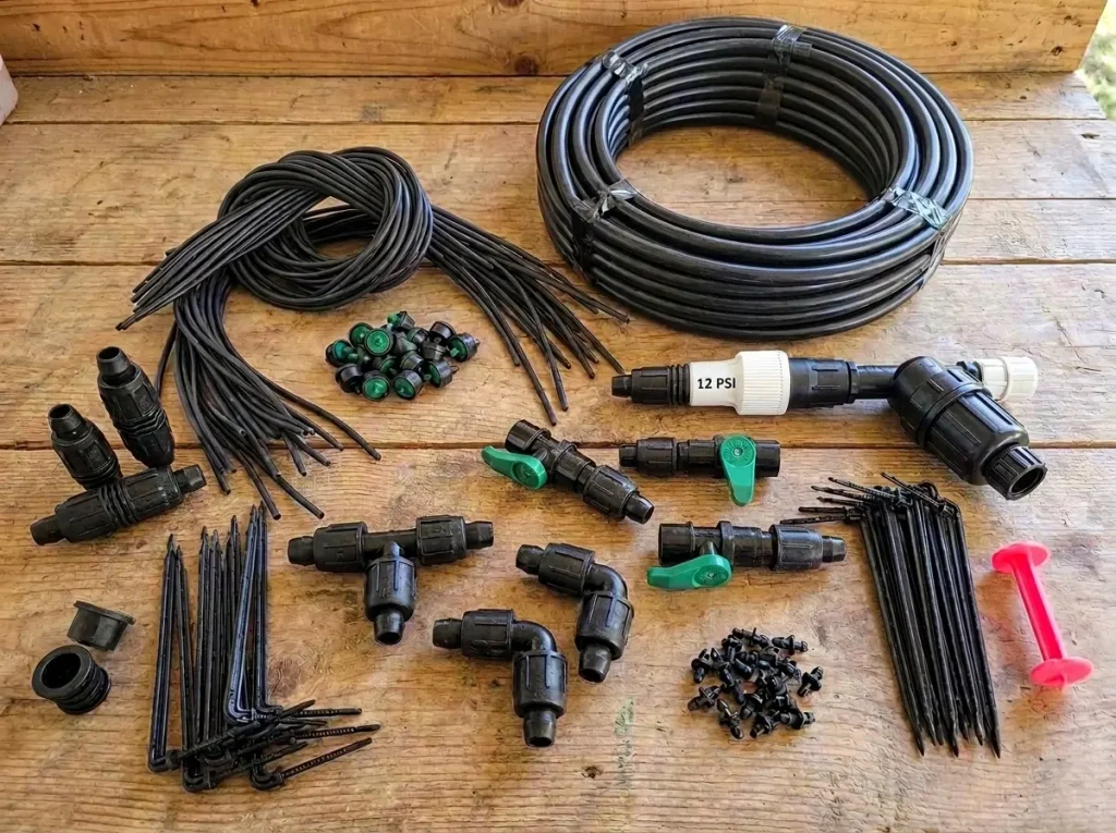 Apple tree drip irrigation components arranged for checking tubing and fitting compatibility